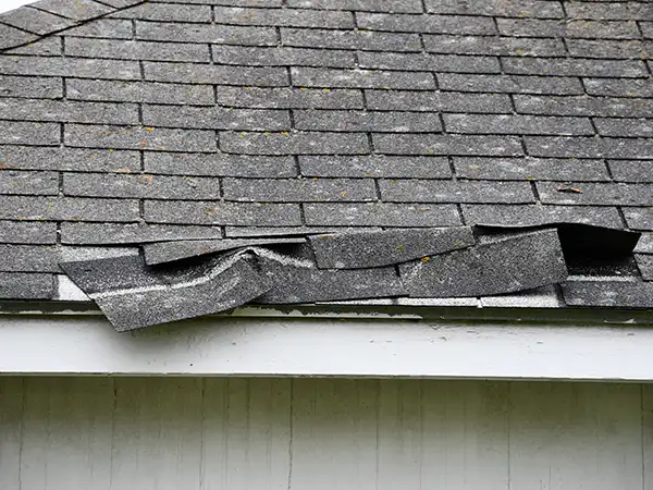 Loose shingles on roof due to hail